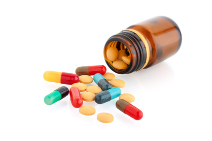 pills and bottle isolated on white background